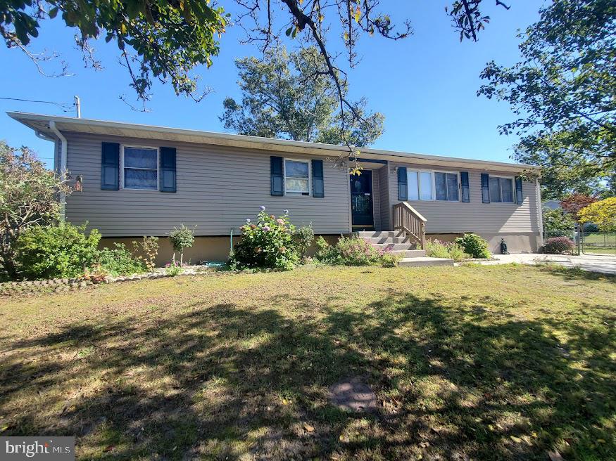 111 Huckleberry Lane Browns Mills, NJ 08015 - Photo 2 of 28 a front view of a house with garden