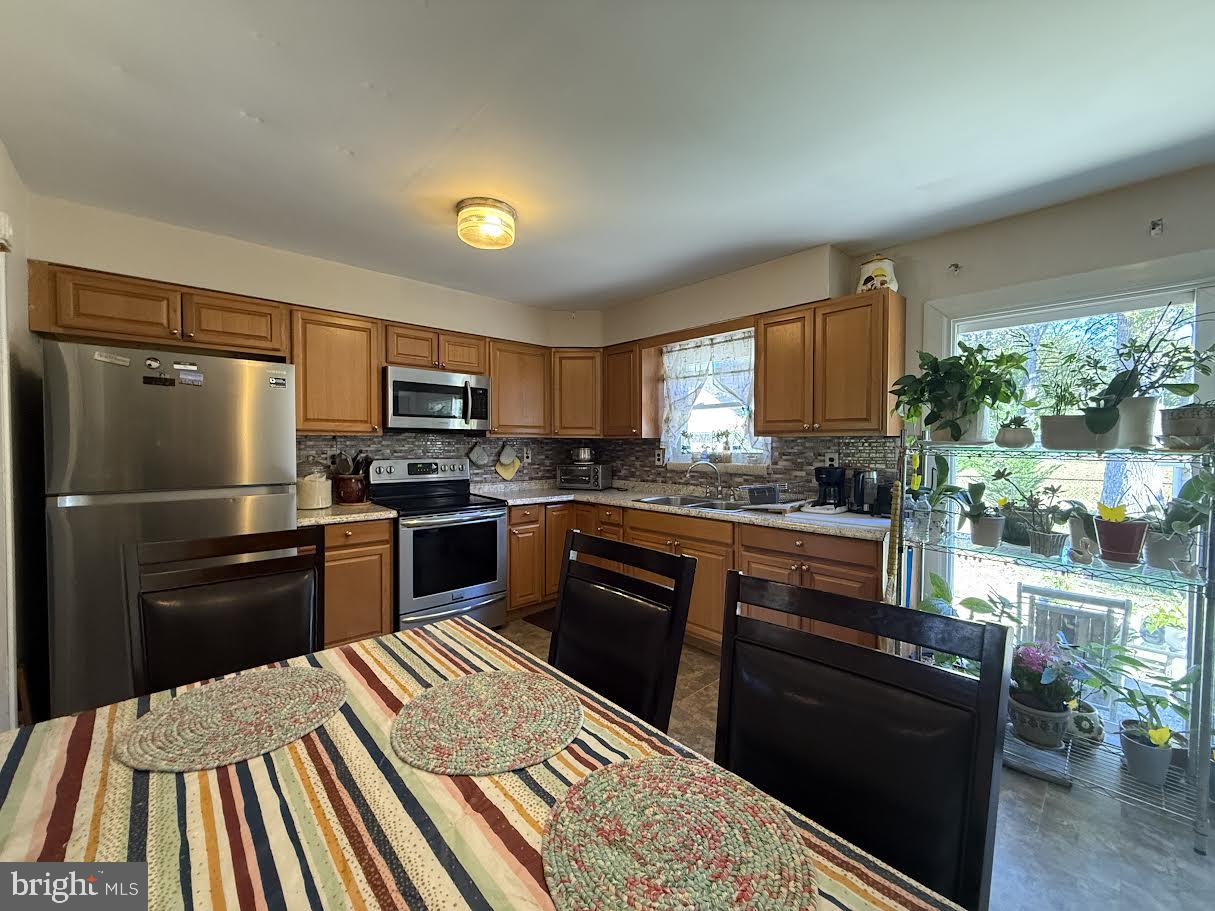 111 Huckleberry Lane Browns Mills, NJ 08015 - Photo 3 of 28 a kitchen with a refrigerator stove and sink