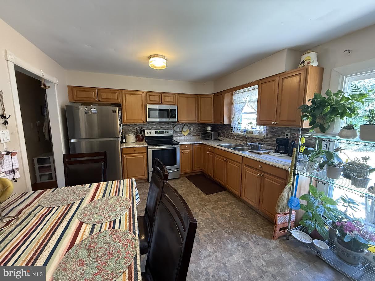 111 Huckleberry Lane Browns Mills, NJ 08015 - Photo 4 of 28 a kitchen with stainless steel appliances granite countertop a stove refrigerator sink and dishwasher