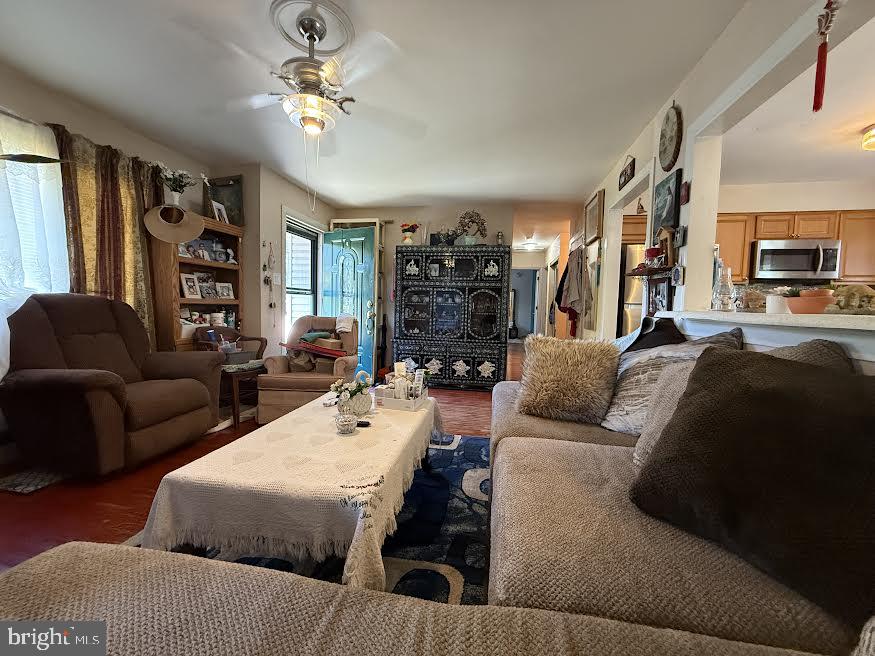 111 Huckleberry Lane Browns Mills, NJ 08015 - Photo 7 of 28 a living room with furniture a fireplace and a chandelier