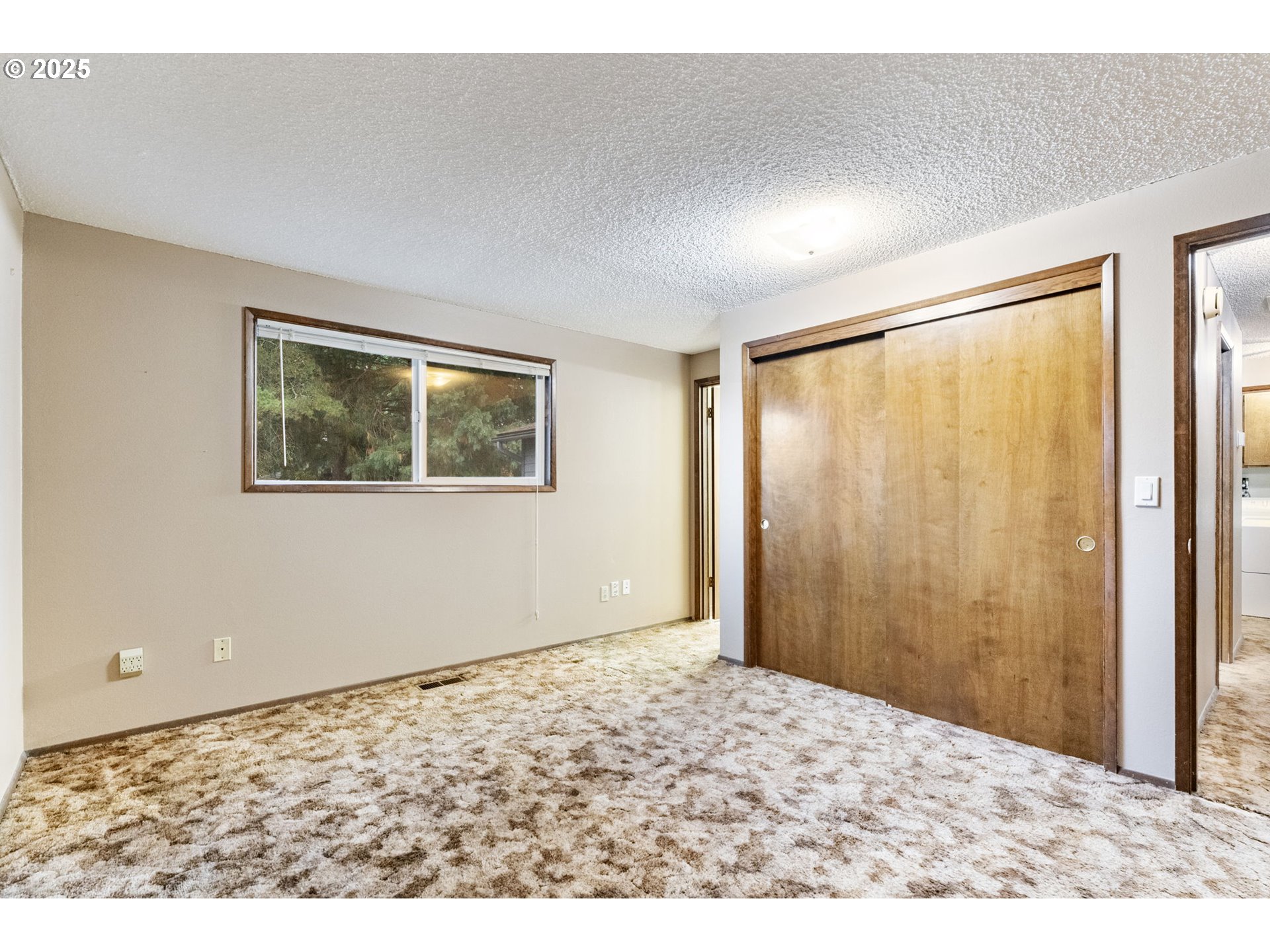 470 Southwest 194th Court Beaverton, OR 97006 - Photo 17 of 31 a view of an empty room with a window