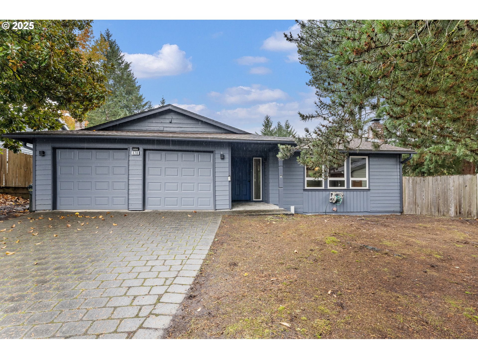 470 Southwest 194th Court Beaverton, OR 97006 - Photo 2 of 31 a front view of a house with a yard and garage
