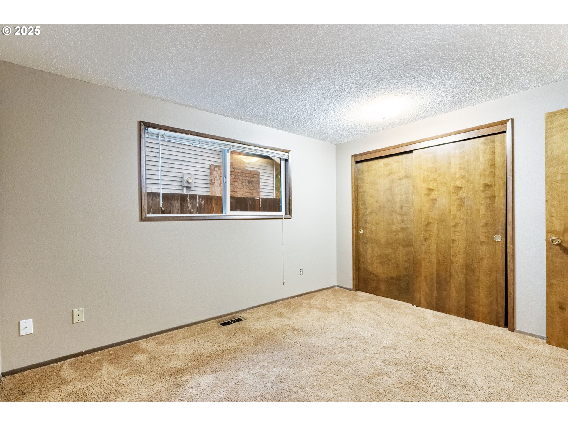 470 Southwest 194th Court Beaverton, OR 97006 - Photo 24 of 31 a view of an empty room with a window