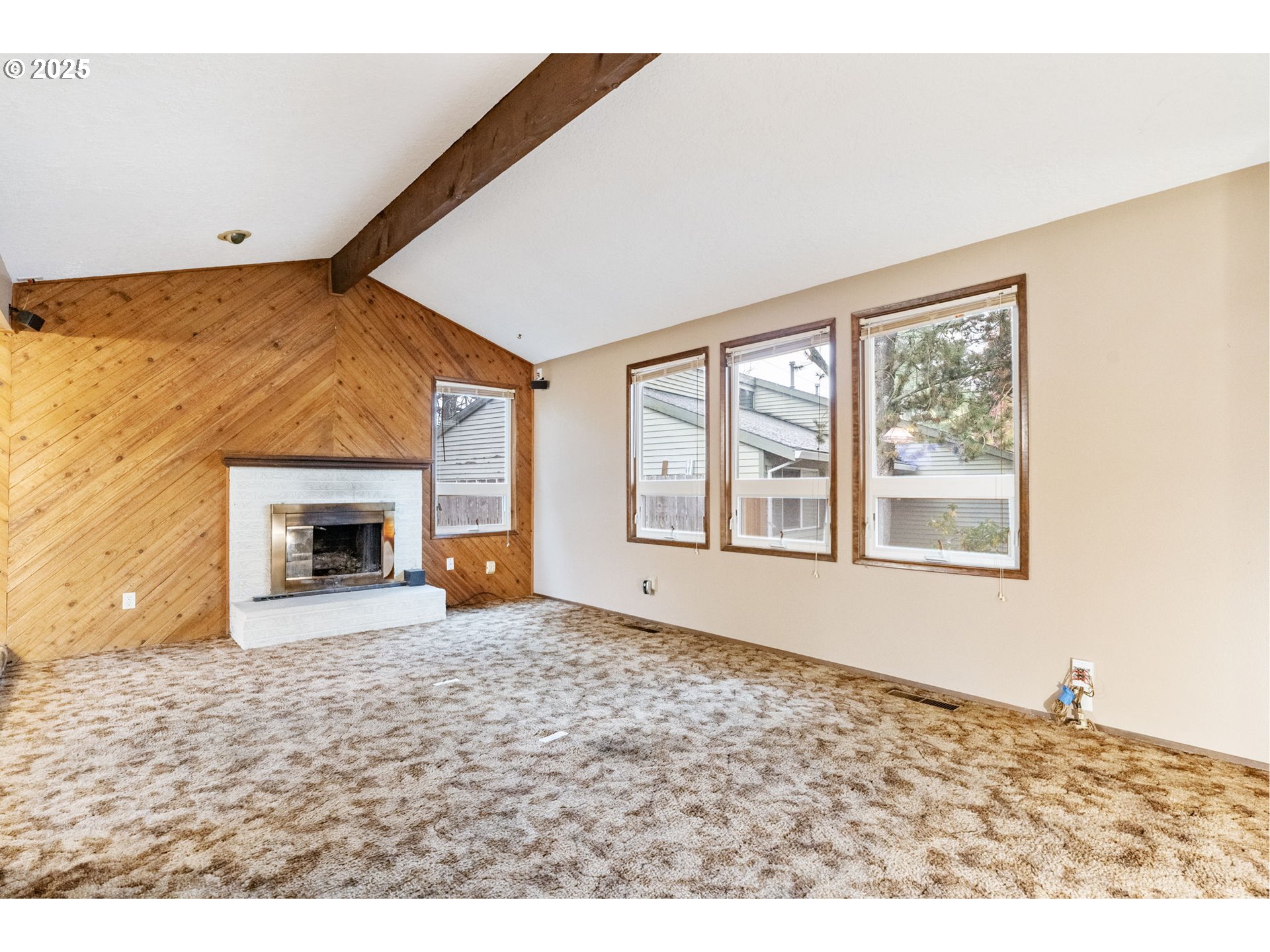 470 Southwest 194th Court Beaverton, OR 97006 - Photo 5 of 31 a view of empty room with a fireplace