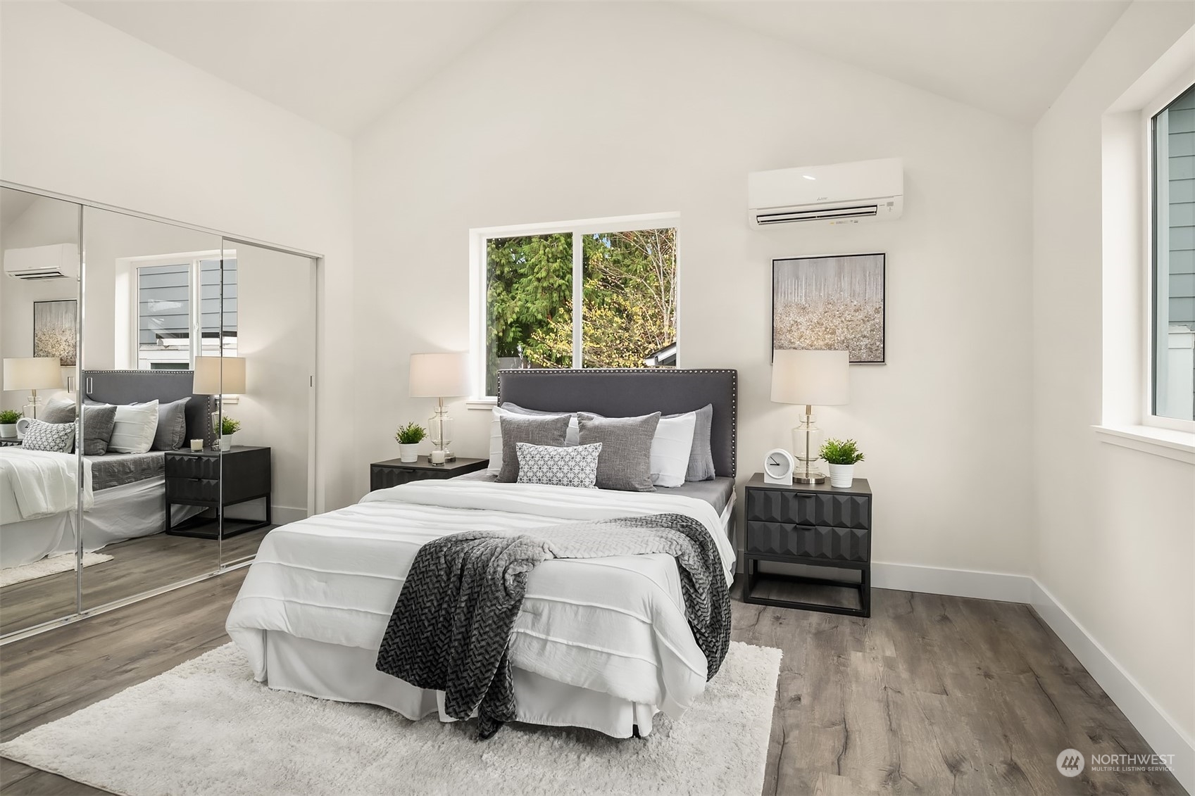 4915 South Genesee Street Seattle, WA 98118 - Photo 5 of 10 a bedroom with a bed and a couch