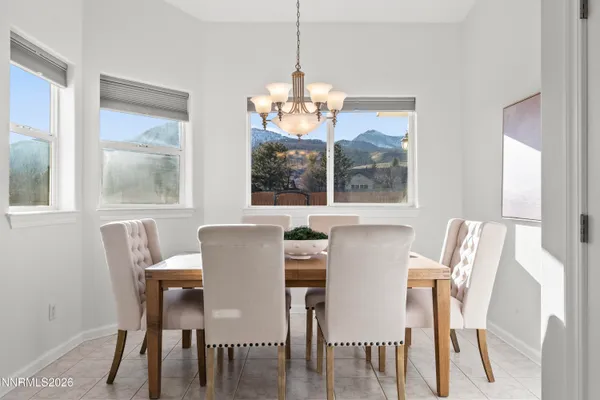 a dining room with furniture and window