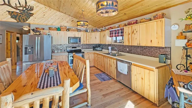 a view of a kitchen with a sink and cabinets