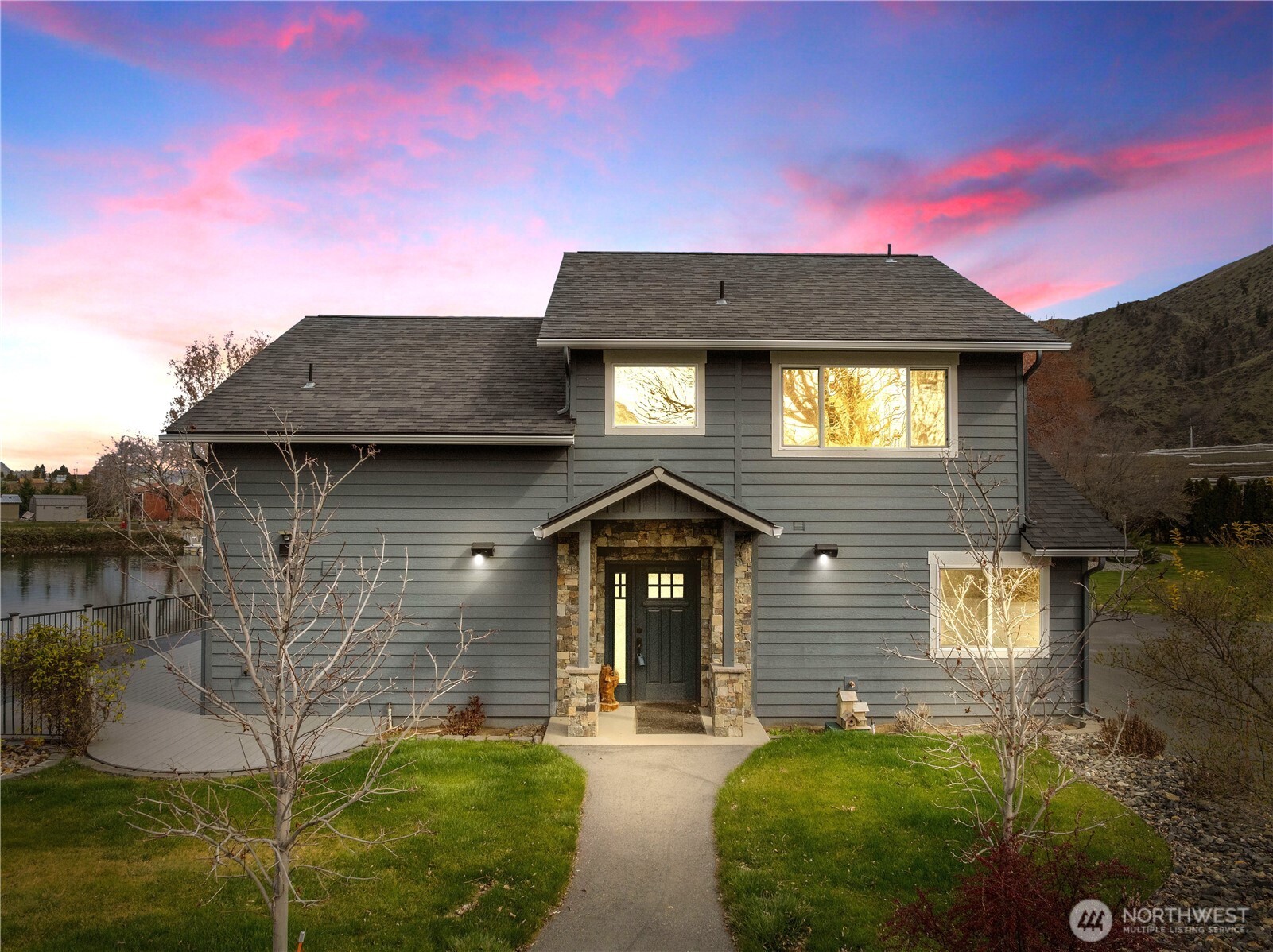 a front view of a house with garden