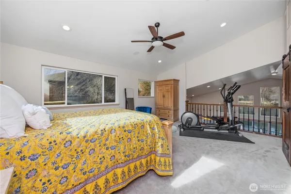 a bedroom with a bed and window