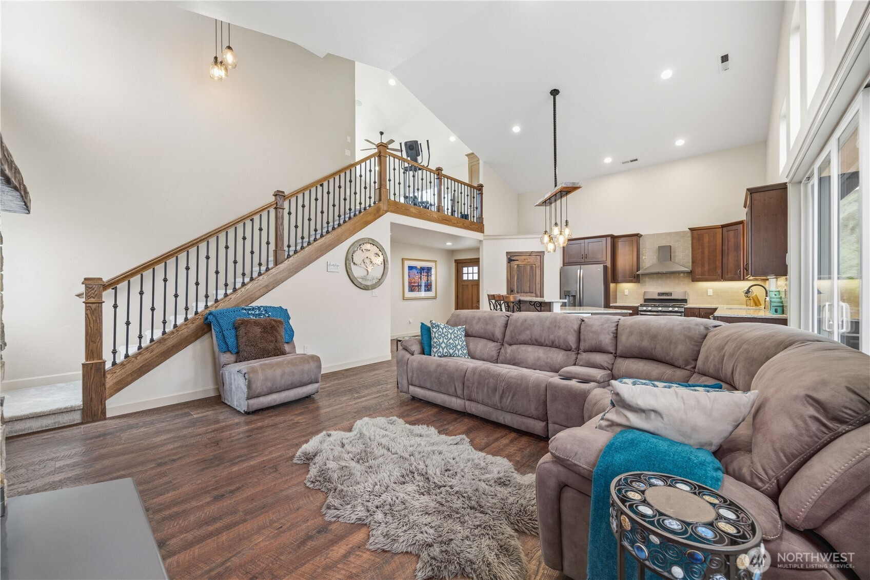 2 Playland Court Orondo, WA 98843 - Photo 15 of 40 a living room with furniture a rug and a chandelier