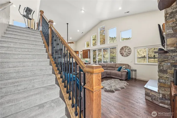 a view of entryway livingroom and hall with wooden floor
