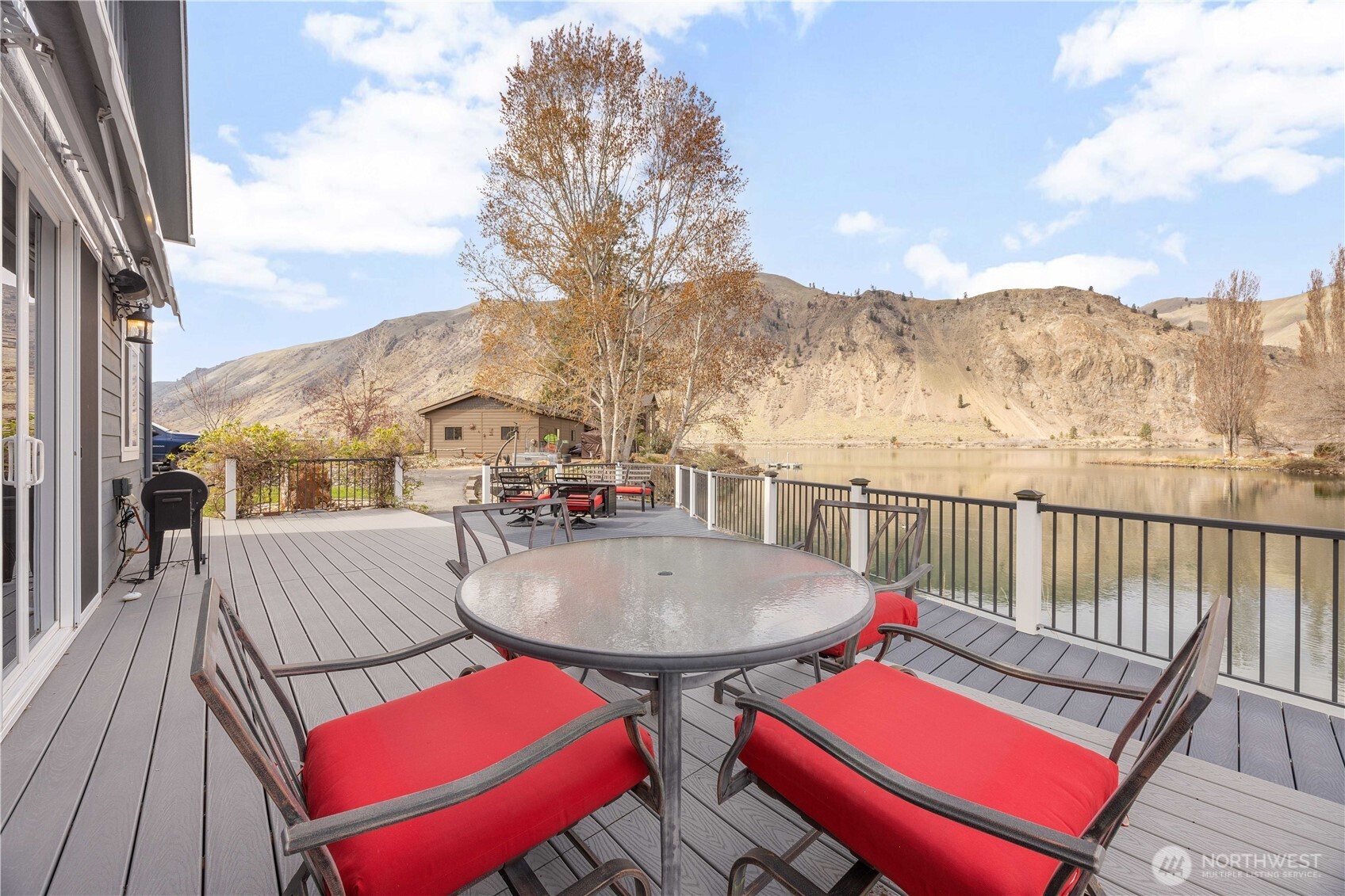 2 Playland Court Orondo, WA 98843 - Photo 24 of 40 a view of a balcony with table and chairs