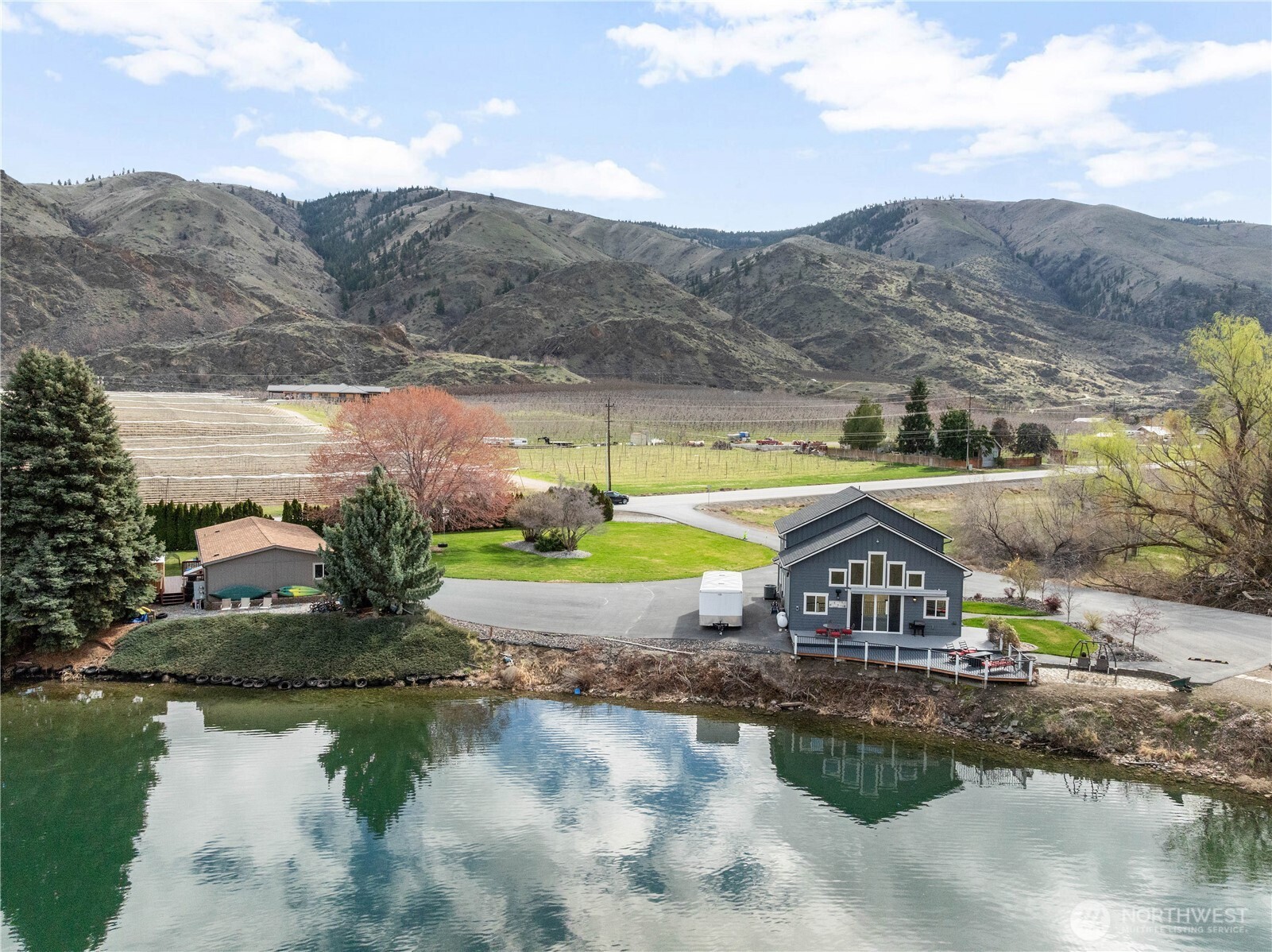 2 Playland Court Orondo, WA 98843 - Photo 25 of 40 a front view of a house with a yard