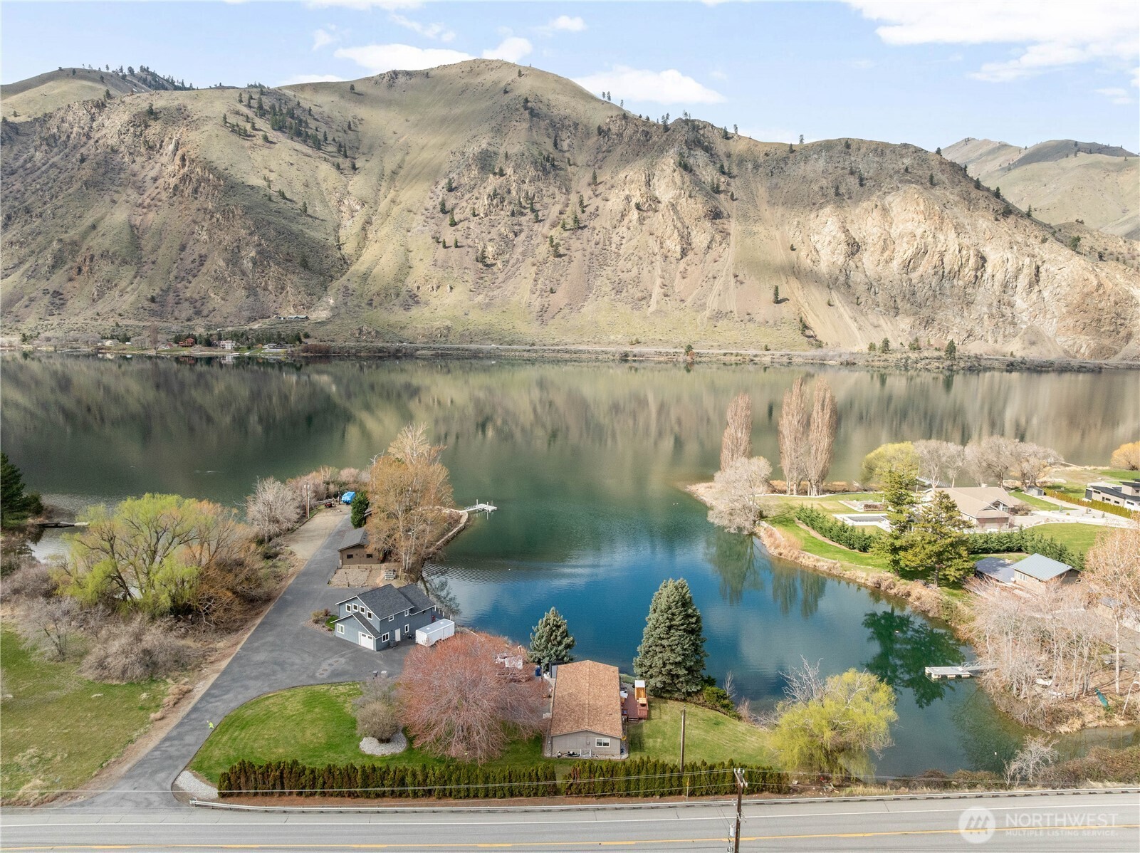 2 Playland Court Orondo, WA 98843 - Photo 35 of 40 a view of a lake with a mountain in the background