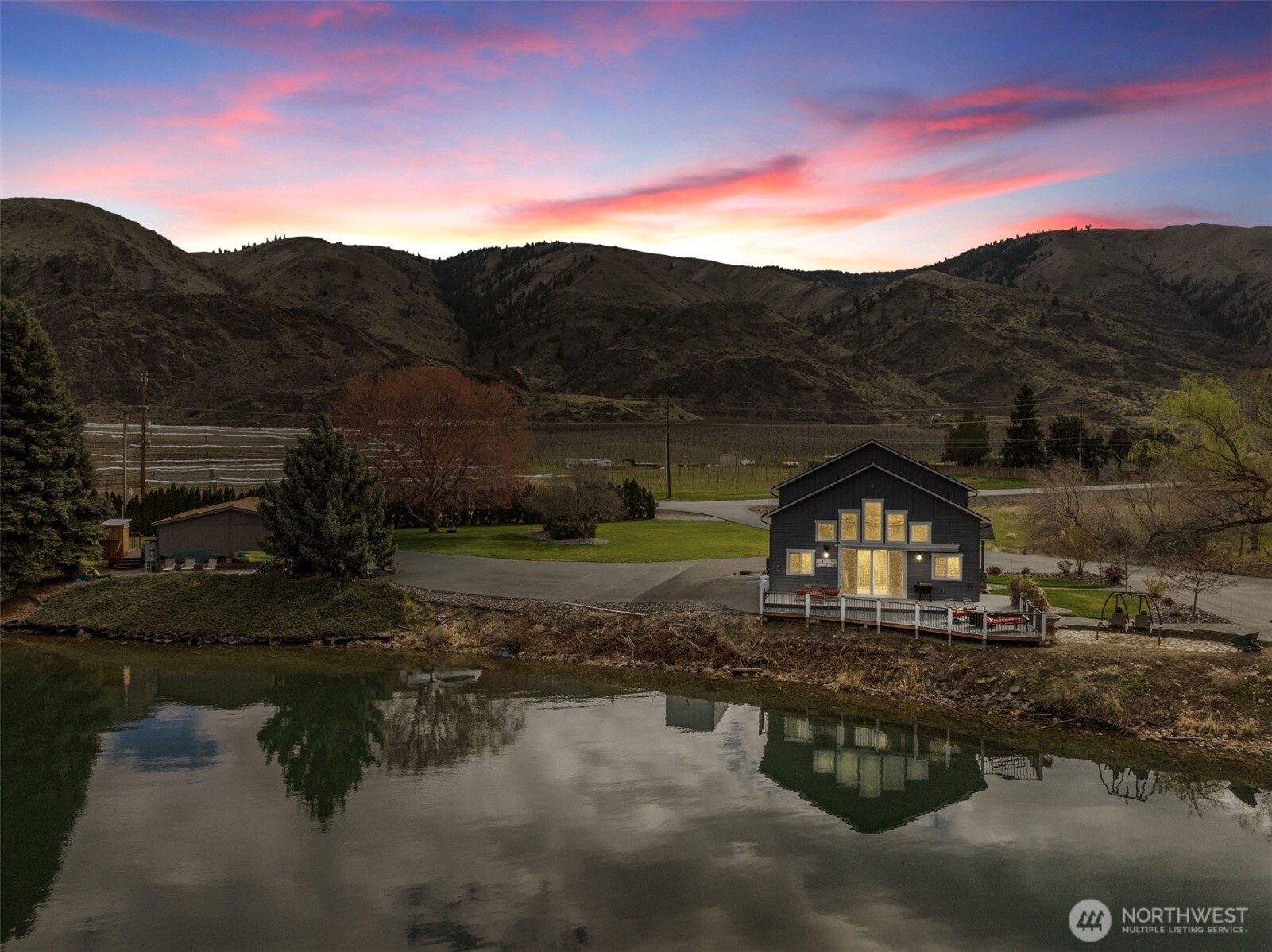2 Playland Court Orondo, WA 98843 - Photo 4 of 40 a front view of a house with a yard