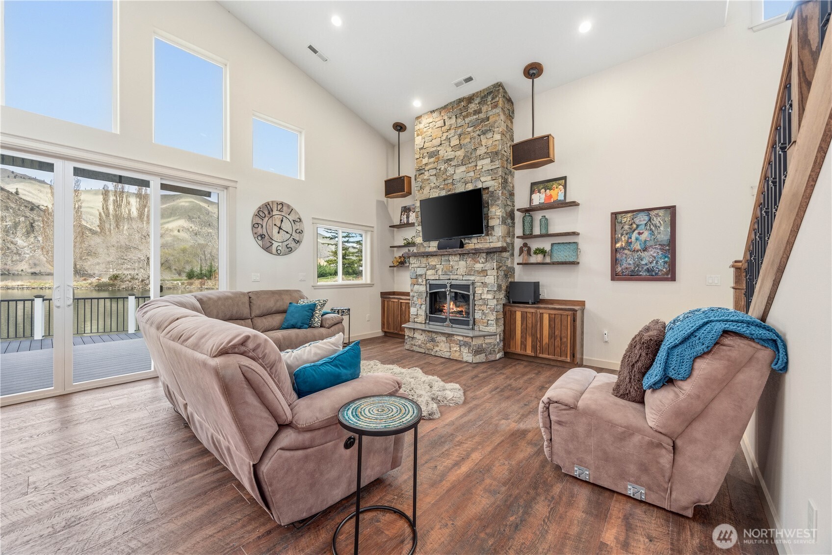 2 Playland Court Orondo, WA 98843 - Photo 9 of 40 a living room with furniture a flat screen tv and a fireplace