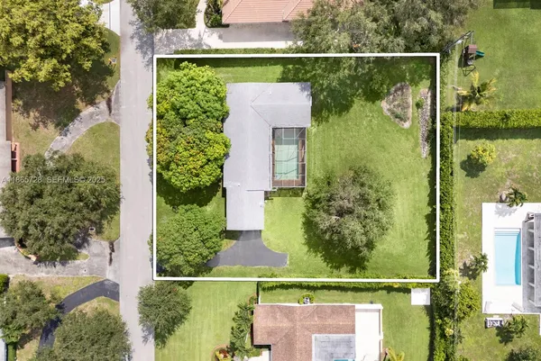 an aerial view of a residential houses with city view