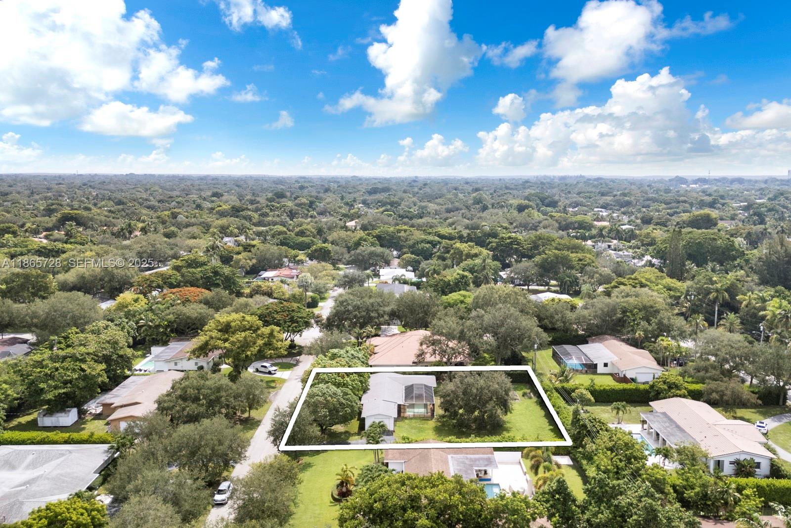 7320 Southwest 131st Street Pinecrest, FL 33156 - Photo 3 of 8 an aerial view of a residential houses with city view