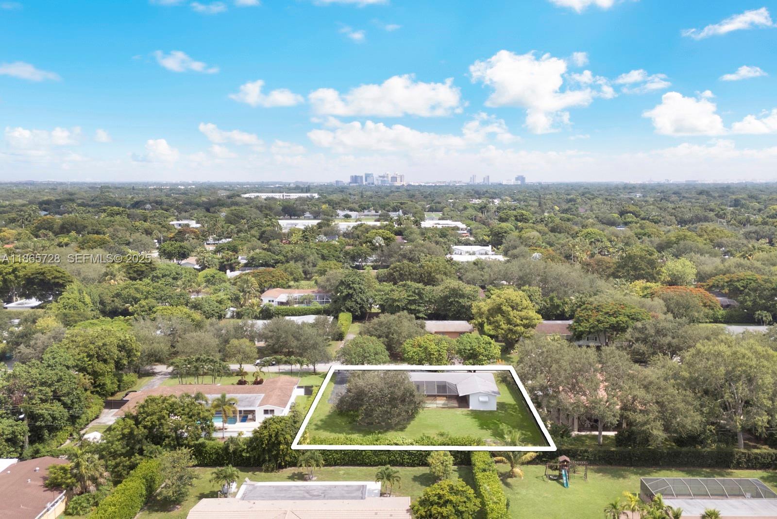 7320 Southwest 131st Street Pinecrest, FL 33156 - Photo 4 of 8 an aerial view of residential houses with outdoor space