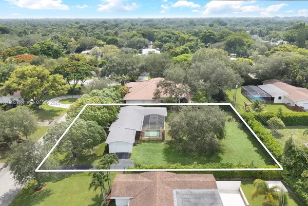 a view of a garden with mountains in the background