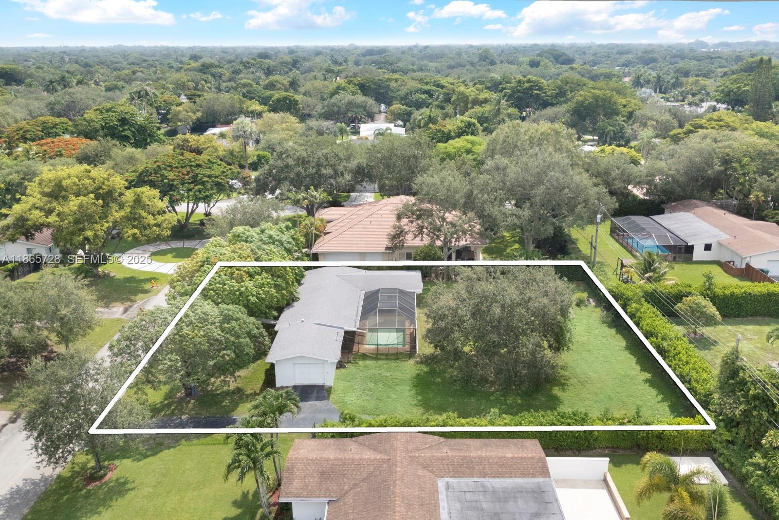 7320 Southwest 131st Street Pinecrest, FL 33156 - Photo 7 of 8 an aerial view of a house