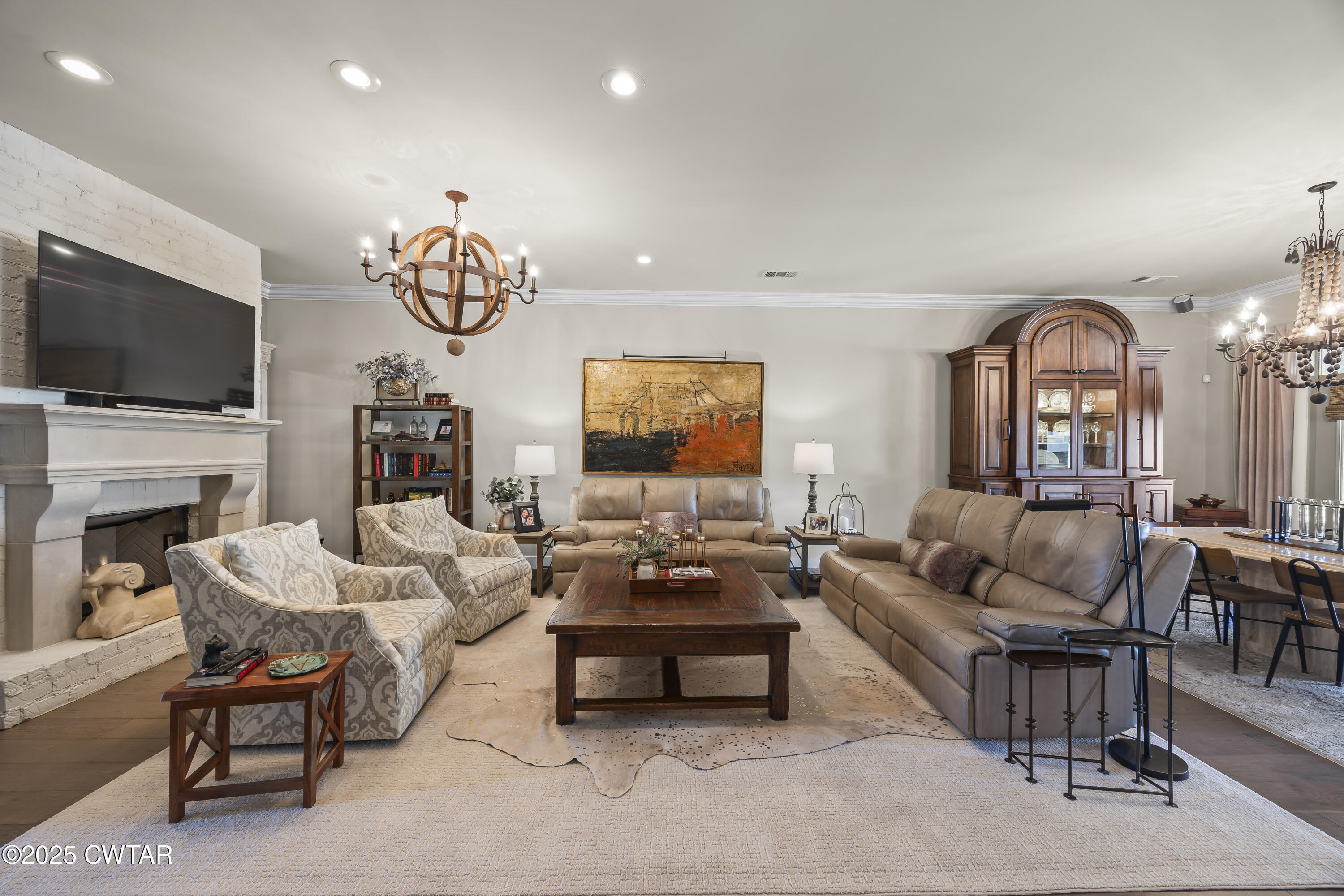 79 Water Ridge Place Jackson, TN 38305 - Photo 12 of 39 a living room with fireplace furniture and a flat screen tv