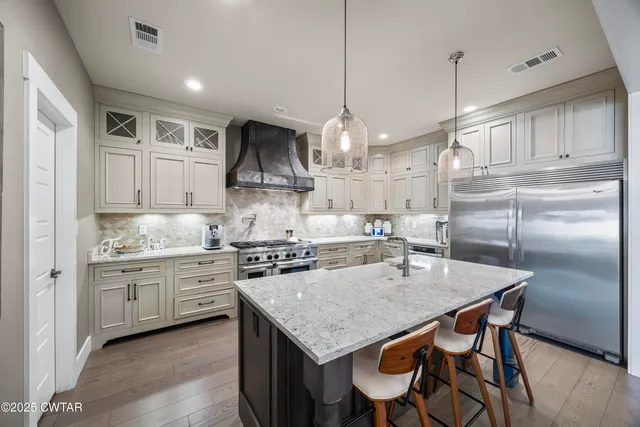 a bedroom with a bed a mirror and furniture