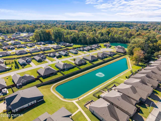 an aerial view of residential houses with outdoor space