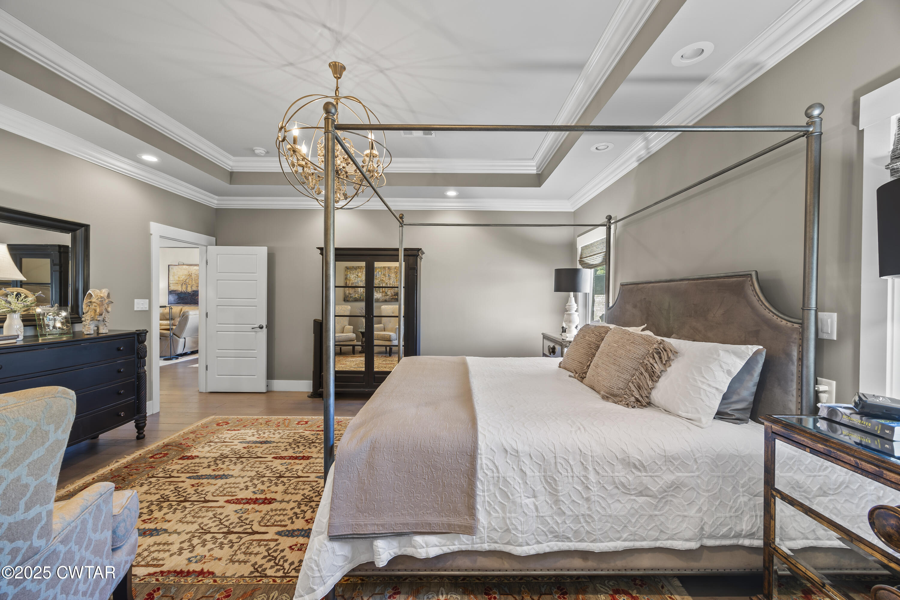 79 Water Ridge Place Jackson, TN 38305 - Photo 23 of 39 a bedroom with a bed a mirror and furniture