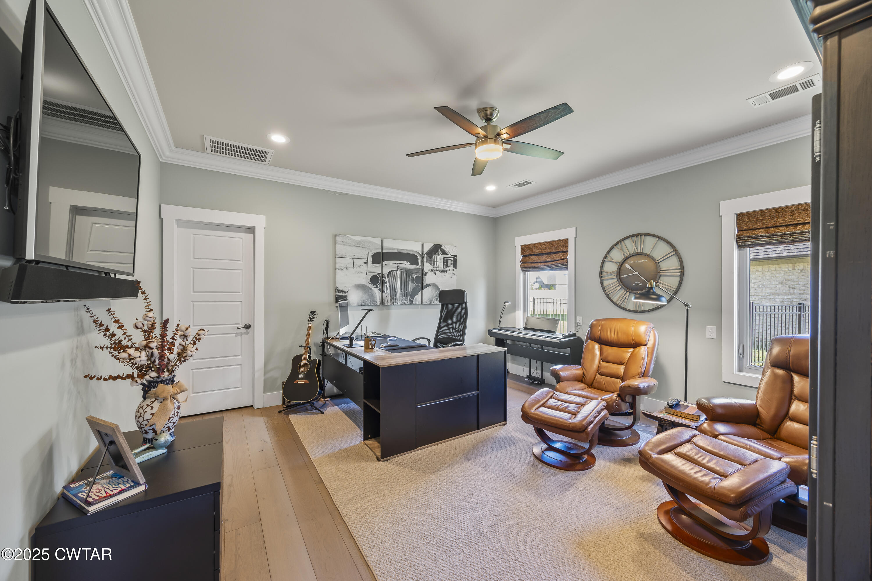 79 Water Ridge Place Jackson, TN 38305 - Photo 28 of 39 a living room with furniture a window and a clock