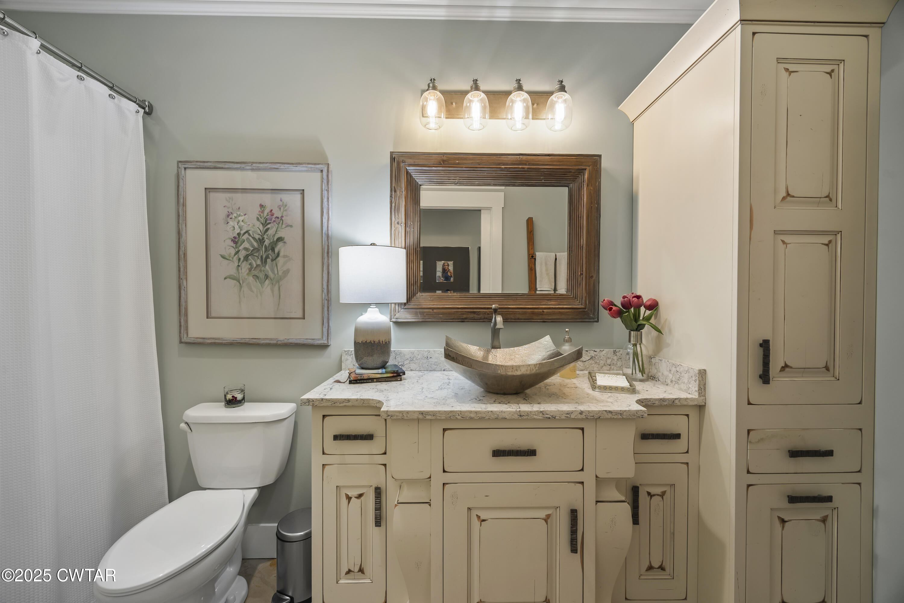 79 Water Ridge Place Jackson, TN 38305 - Photo 32 of 39 a bathroom with a toilet sink and mirror