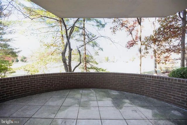 a view of sitting area with wooden fence