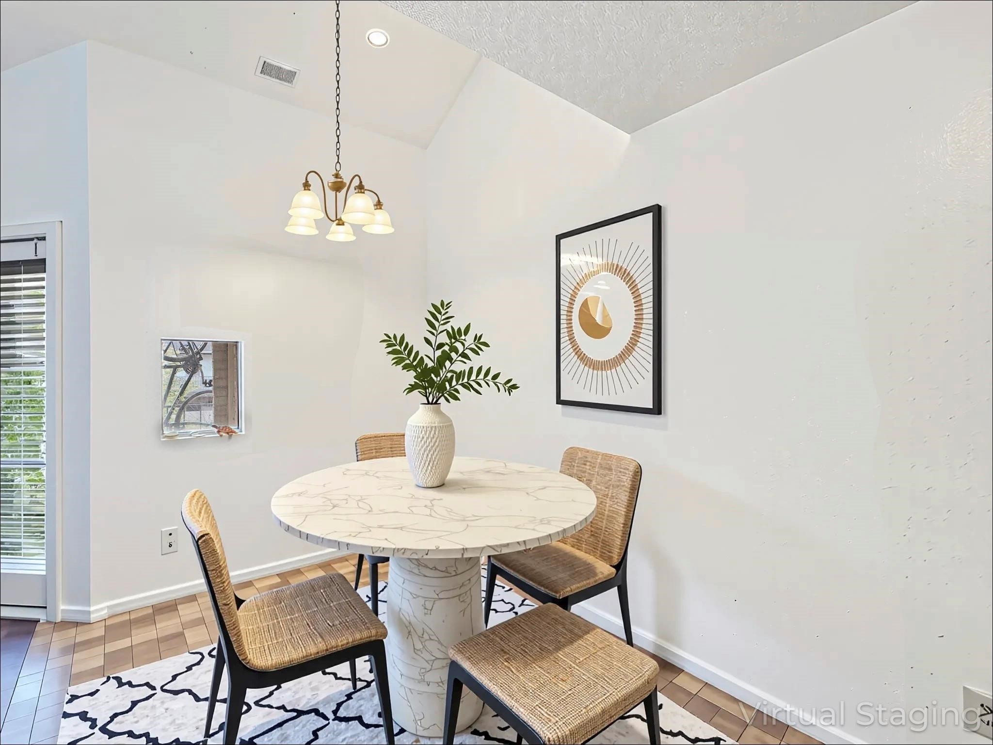 a dining room with furniture and window