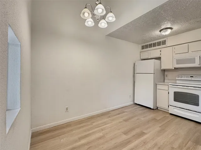 a view of a storage & utility room with a sink