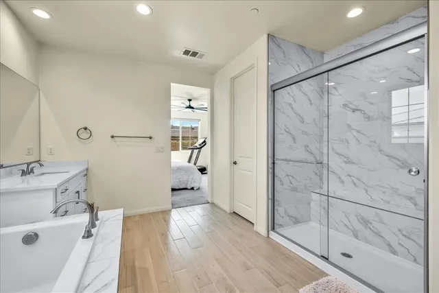 a bathroom with a bathtub and a shower