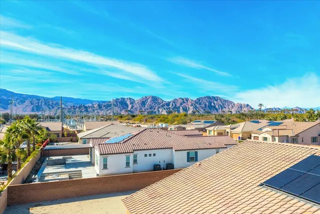 an aerial view of residential houses and outdoor space