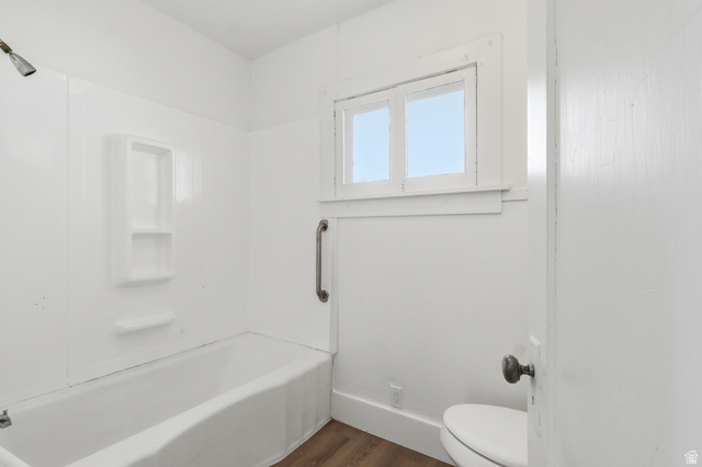 871 North 700 East Logan, UT 84321 - Photo 6 of 20 Full bath featuring dark wood finished floors and washtub / shower combination