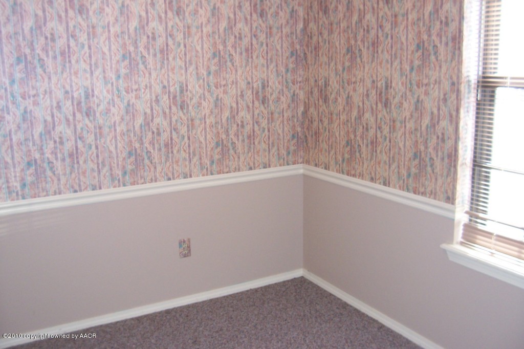 5309 Capulin Lane Amarillo, TX 79110 - Photo 7 of 16 a view of an empty room with a window