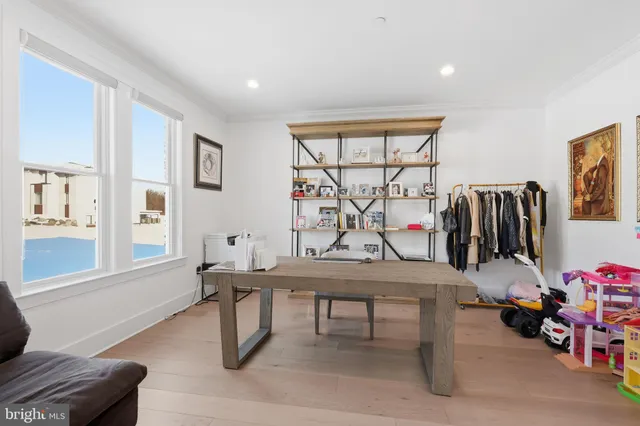 a bedroom with a bed and a chair