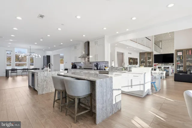 a living room with furniture and a painting on the wall