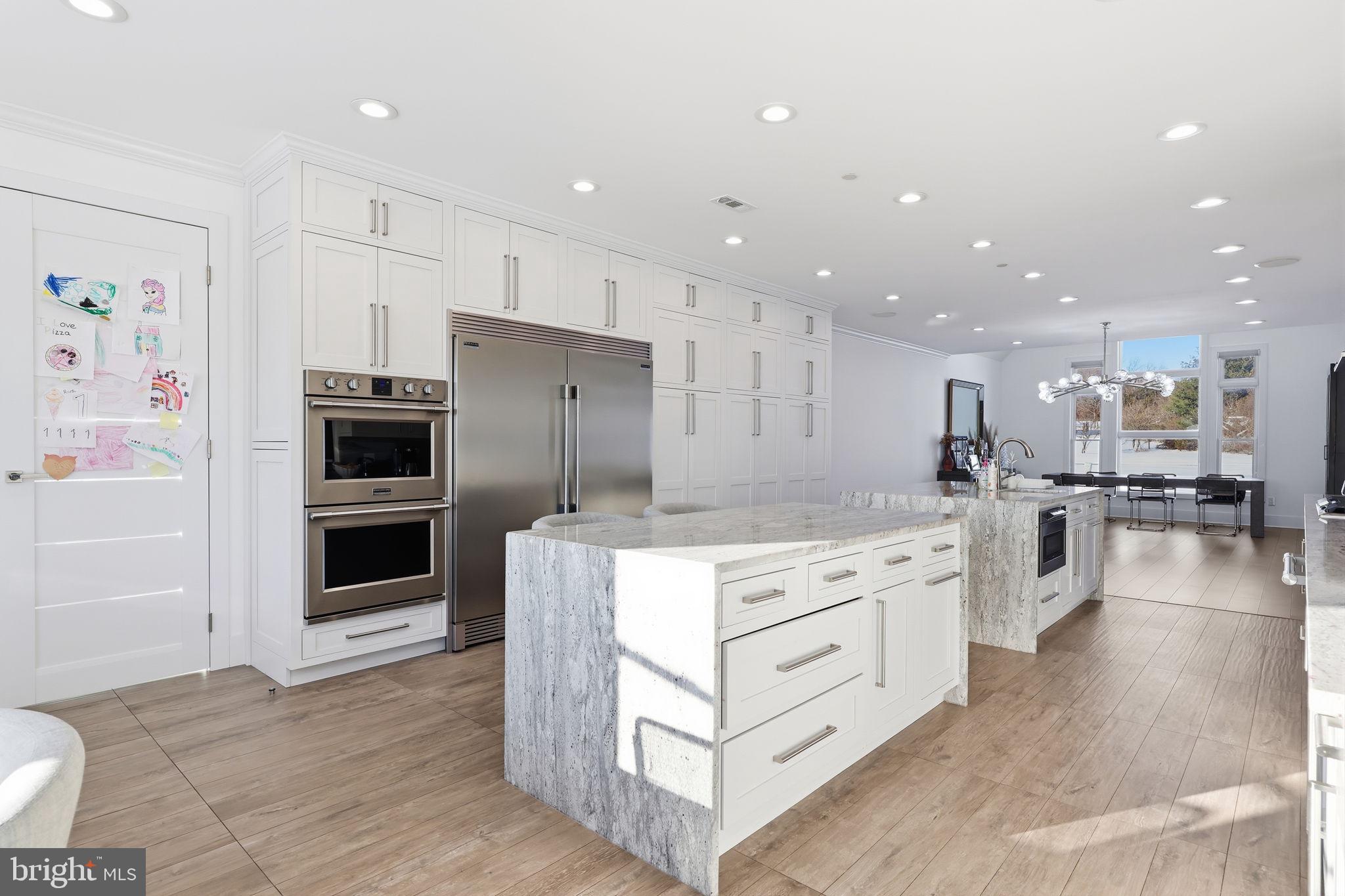 2145 Second Street Pike Newtown, PA 18940 - Photo 26 of 79 a kitchen with stainless steel appliances kitchen island granite countertop a stove and a refrigerator