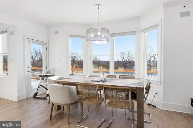 a view of a livingroom with furniture and a flat screen tv
