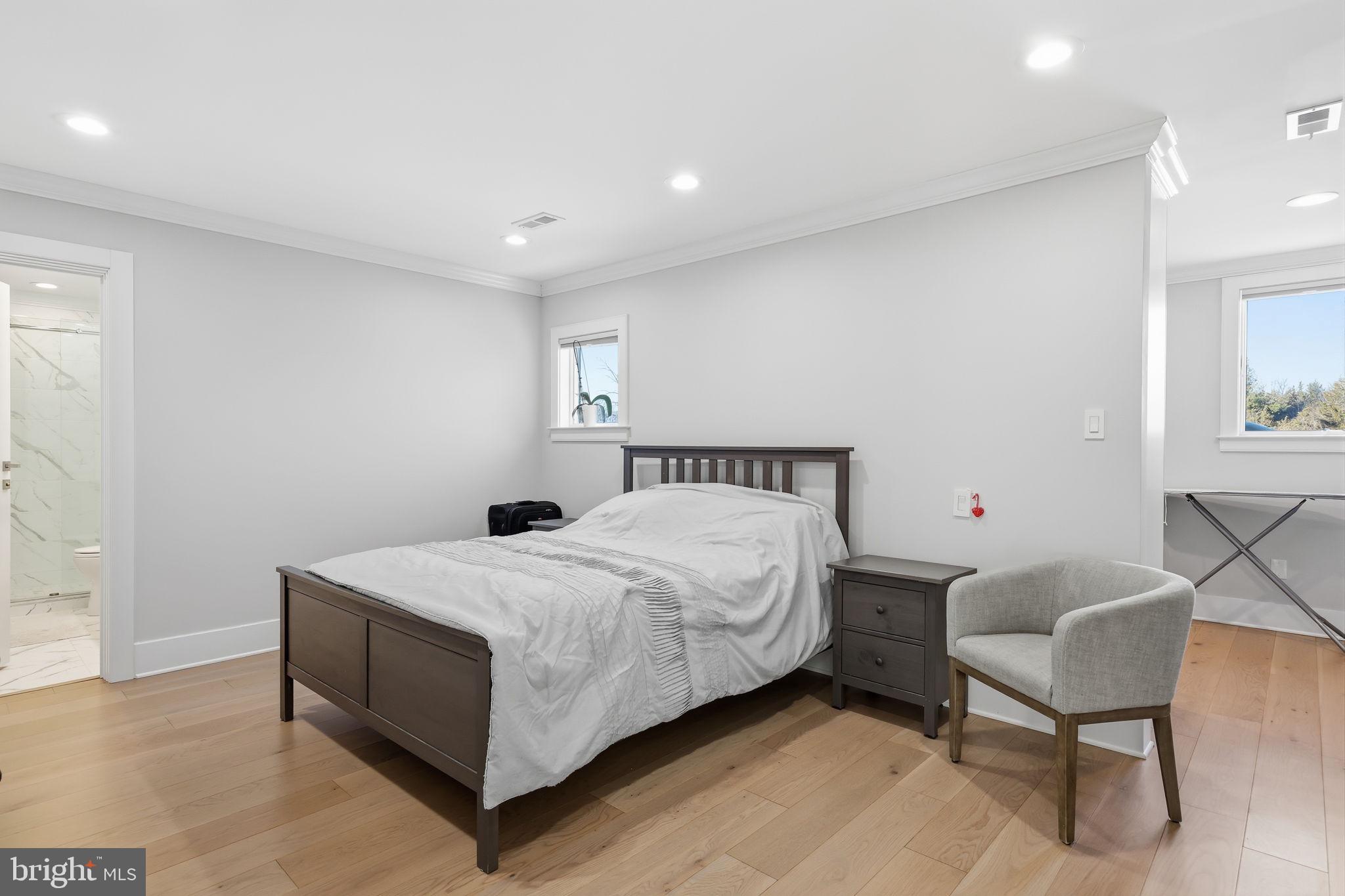 2145 Second Street Pike Newtown, PA 18940 - Photo 51 of 79 a bedroom with a bed and a chair