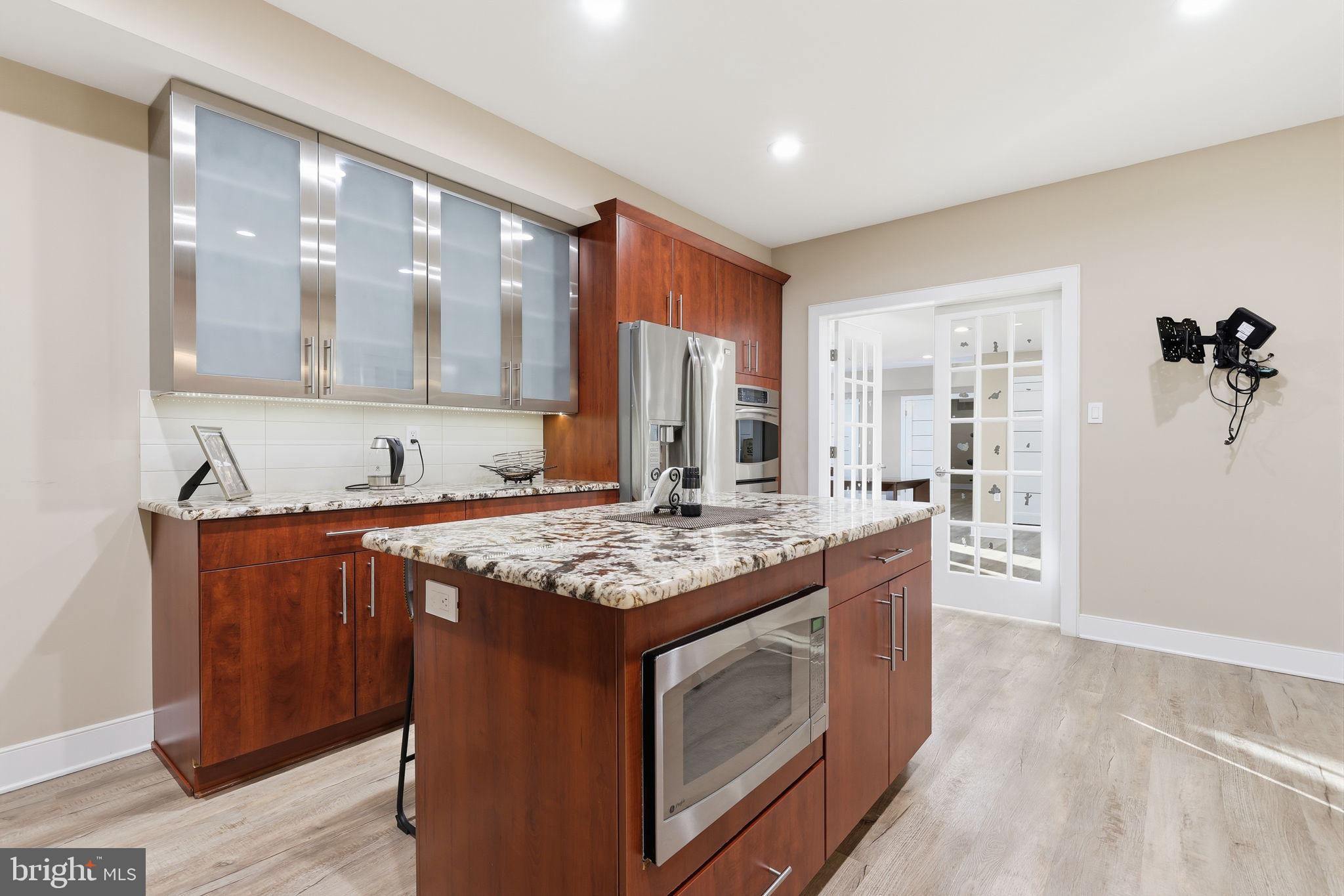 2145 Second Street Pike Newtown, PA 18940 - Photo 62 of 79 a kitchen with stainless steel appliances granite countertop a stove and a sink