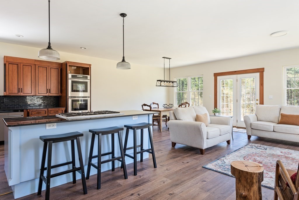 249 Blackmore Pond Road Wareham, MA 02576 - Photo 12 of 41 a very nice looking living room with furniture and wooden floor