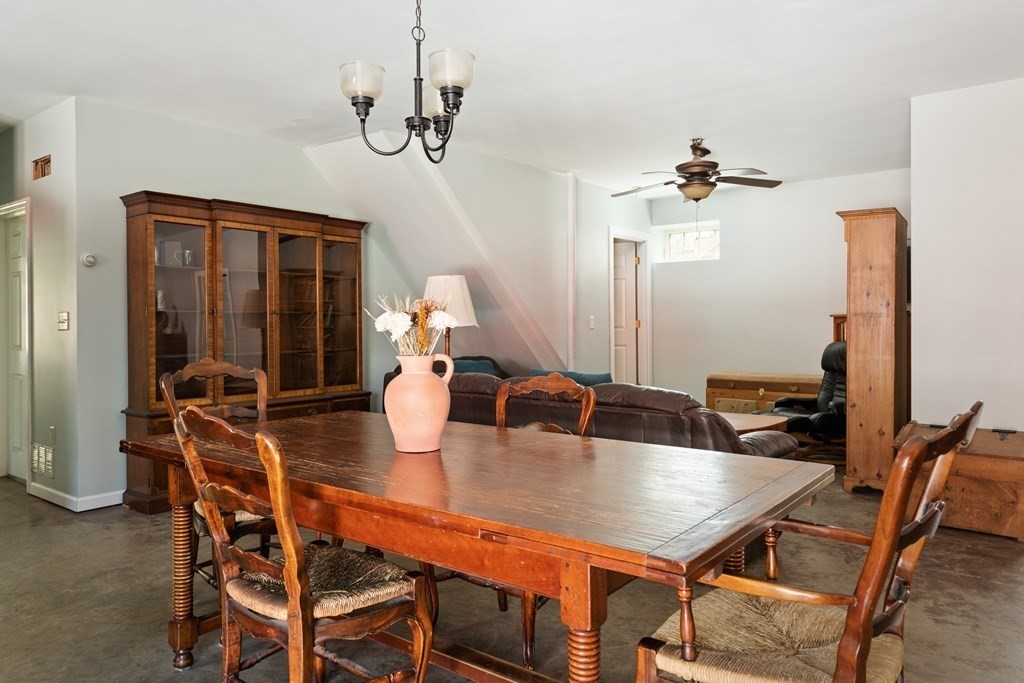 249 Blackmore Pond Road Wareham, MA 02576 - Photo 23 of 41 a view of a dining room with furniture and wooden floor