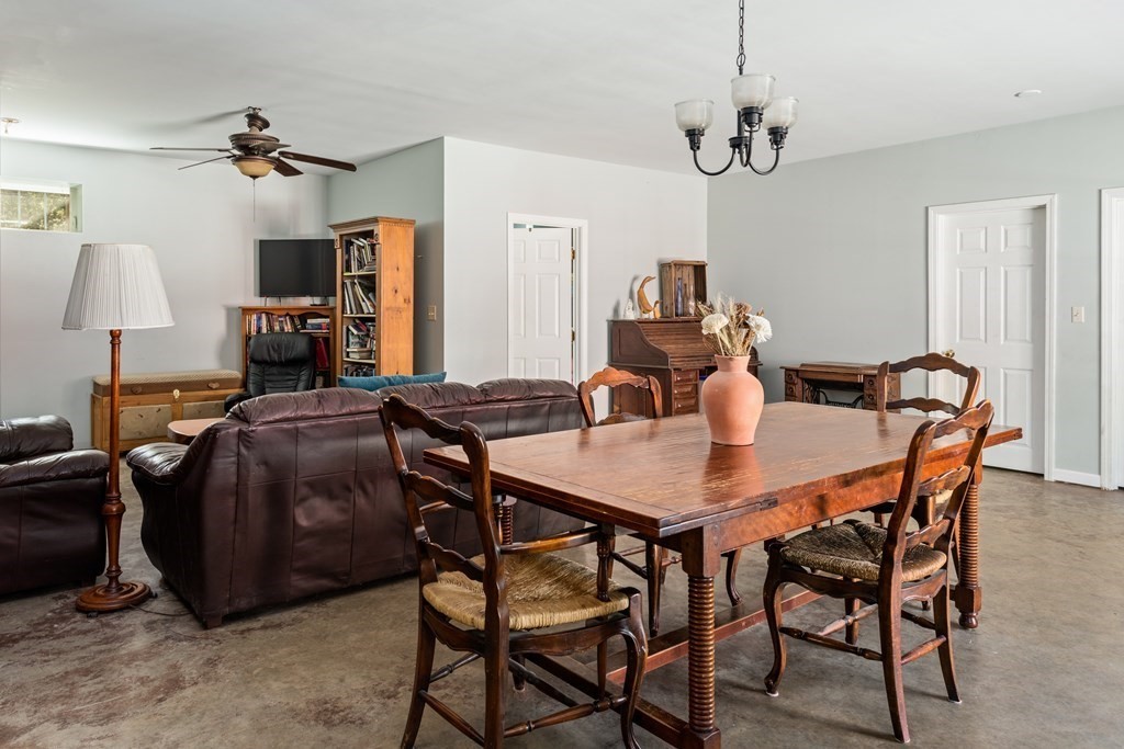 249 Blackmore Pond Road Wareham, MA 02576 - Photo 25 of 41 a view of a dining room with furniture