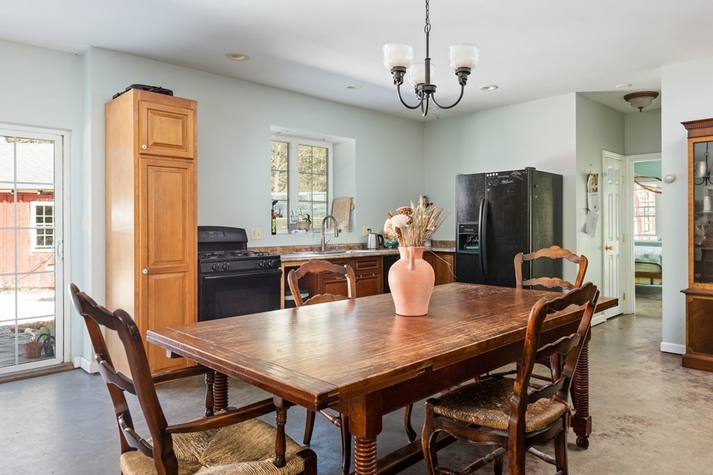 249 Blackmore Pond Road Wareham, MA 02576 - Photo 26 of 41 a view of a dining room with furniture window and wooden floor