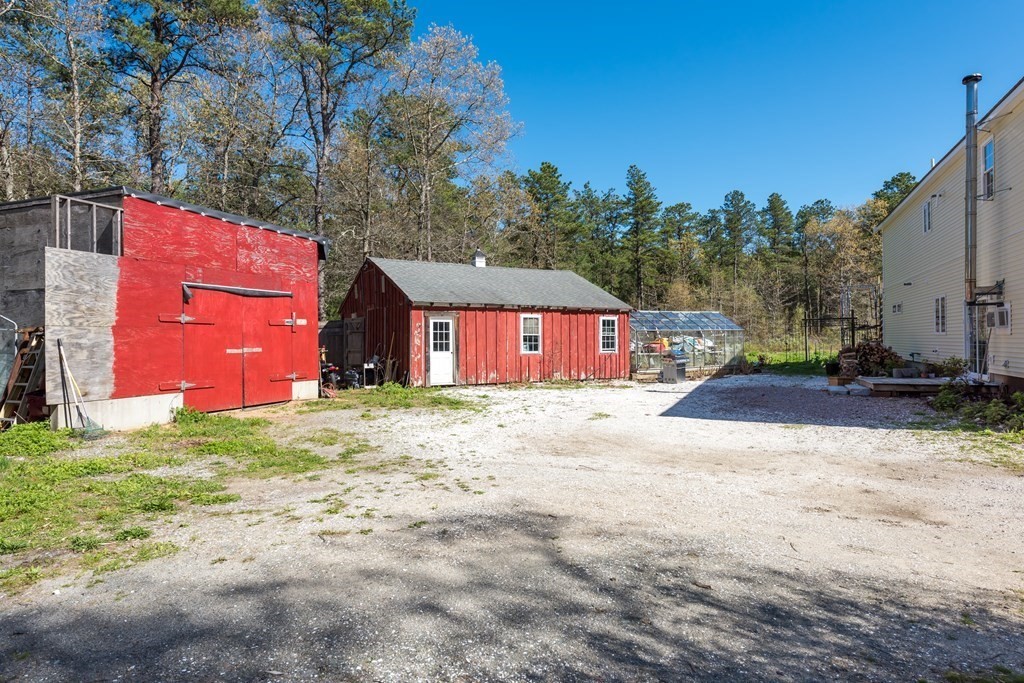 249 Blackmore Pond Road Wareham, MA 02576 - Photo 29 of 41 a front view of a house with a yard