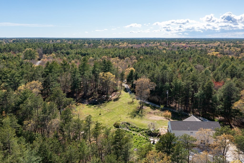 249 Blackmore Pond Road Wareham, MA 02576 - Photo 33 of 41 a view of a yard with a lake view